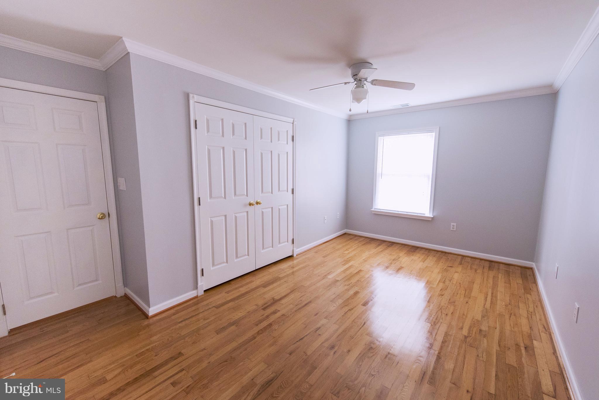 95 Orchard Drive Ranson, WV 25438 - Photo 12 of 22 a view of an empty room with wooden floor and a window