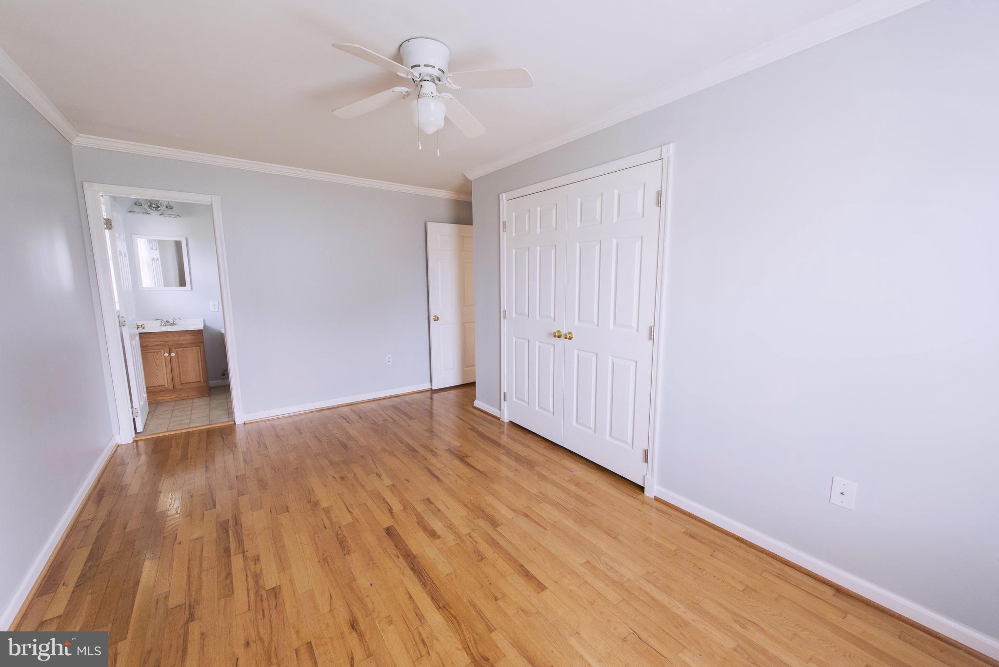 95 Orchard Drive Ranson, WV 25438 - Photo 13 of 22 a view of empty room with wooden floor and fan