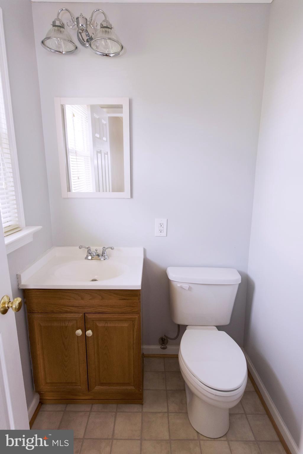 95 Orchard Drive Ranson, WV 25438 - Photo 14 of 22 a bathroom with a toilet sink and mirror