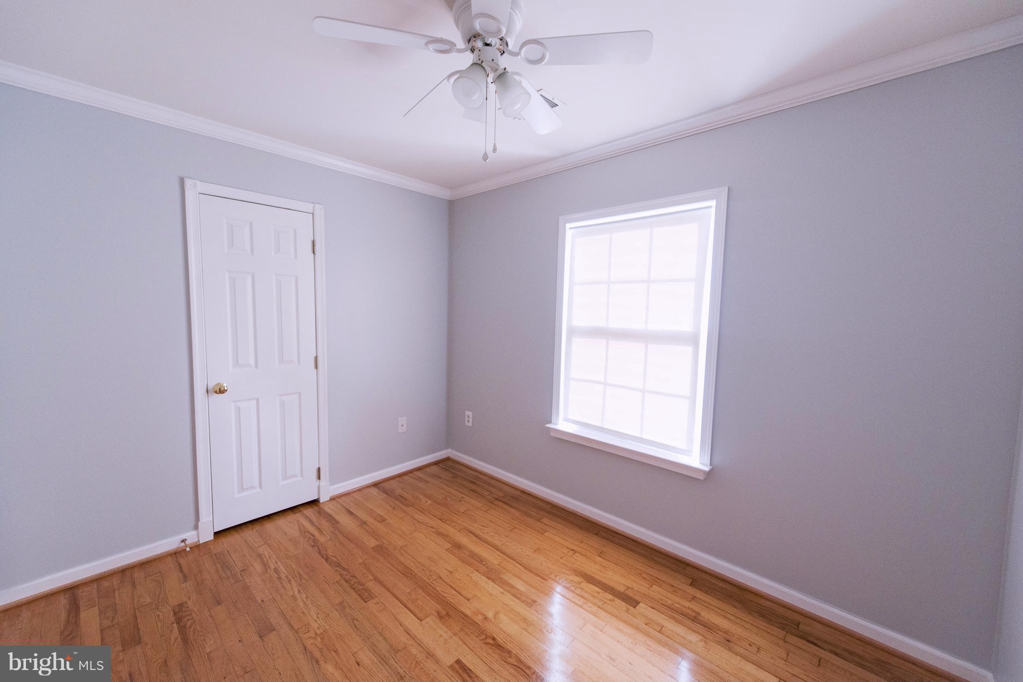 95 Orchard Drive Ranson, WV 25438 - Photo 15 of 22 wooden floor in an empty room with a window