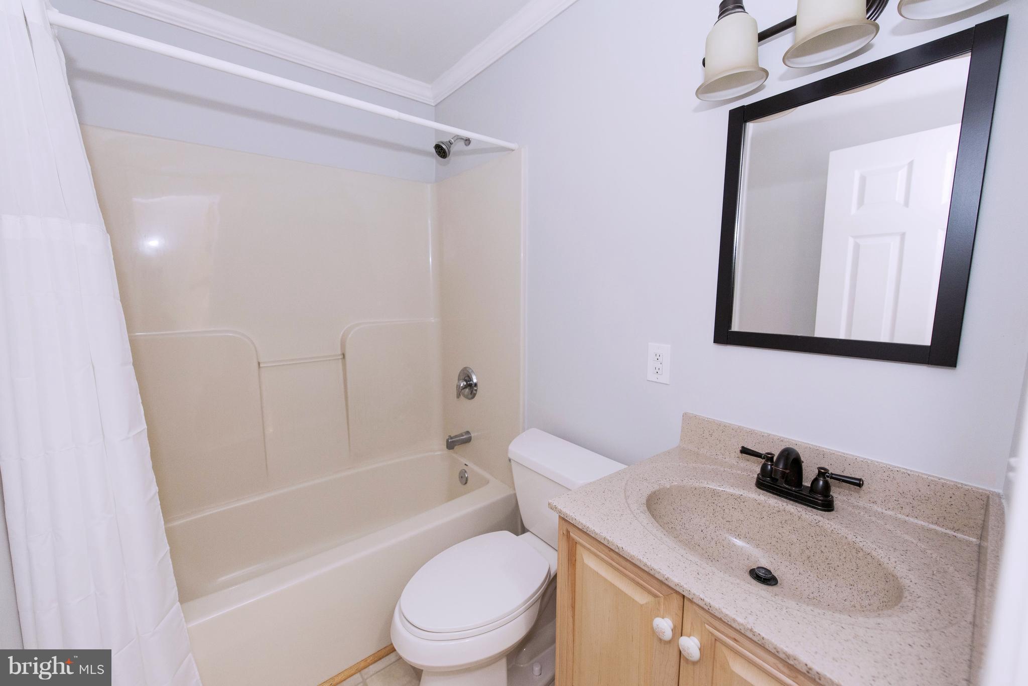 95 Orchard Drive Ranson, WV 25438 - Photo 17 of 22 a bathroom with a sink toilet and shower
