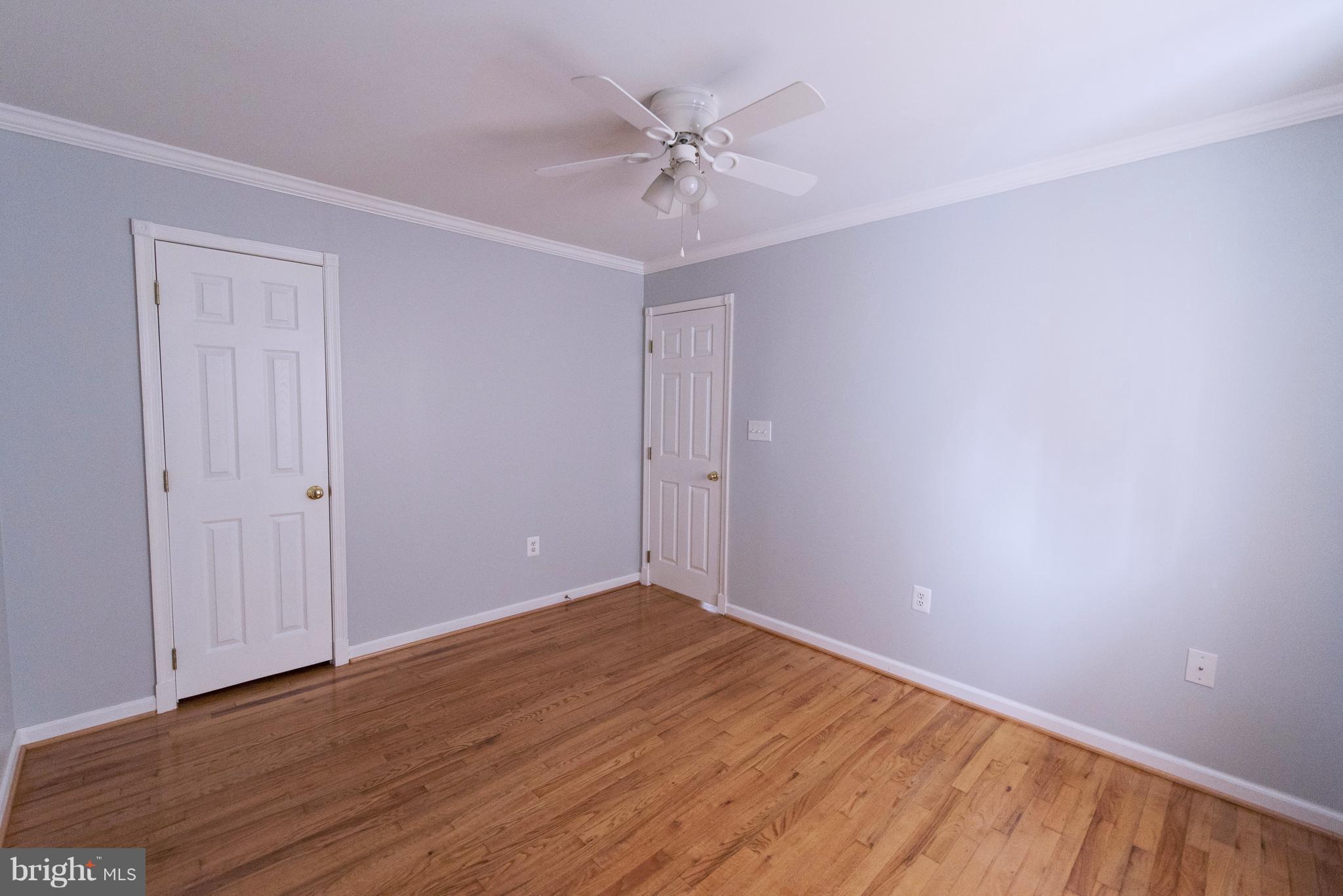 95 Orchard Drive Ranson, WV 25438 - Photo 18 of 22 a view of a room with wooden floor and a ceiling fan