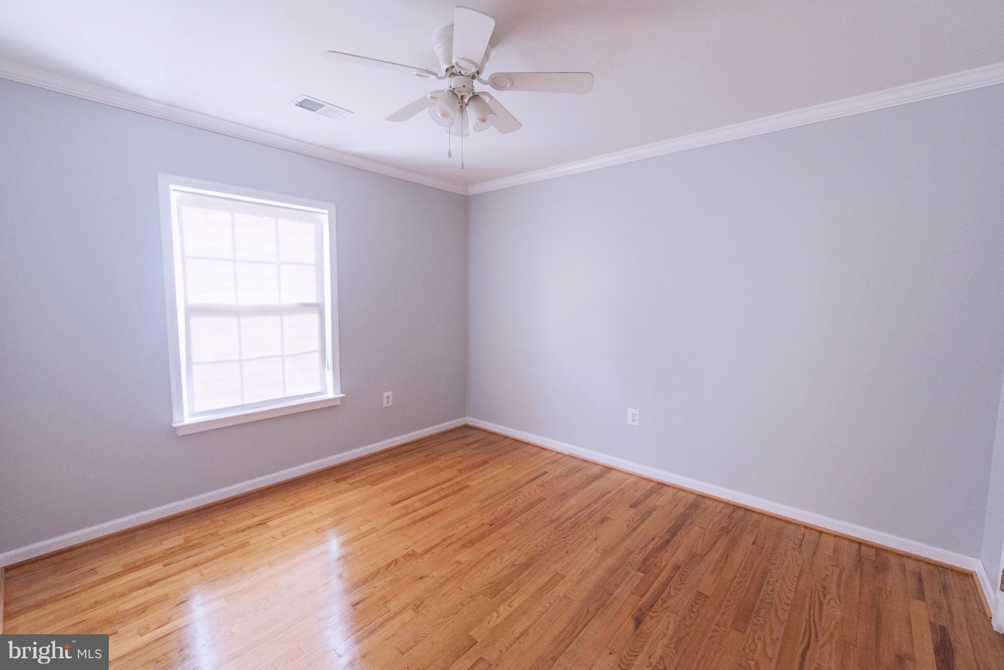 95 Orchard Drive Ranson, WV 25438 - Photo 19 of 22 an empty room with a window and a fan