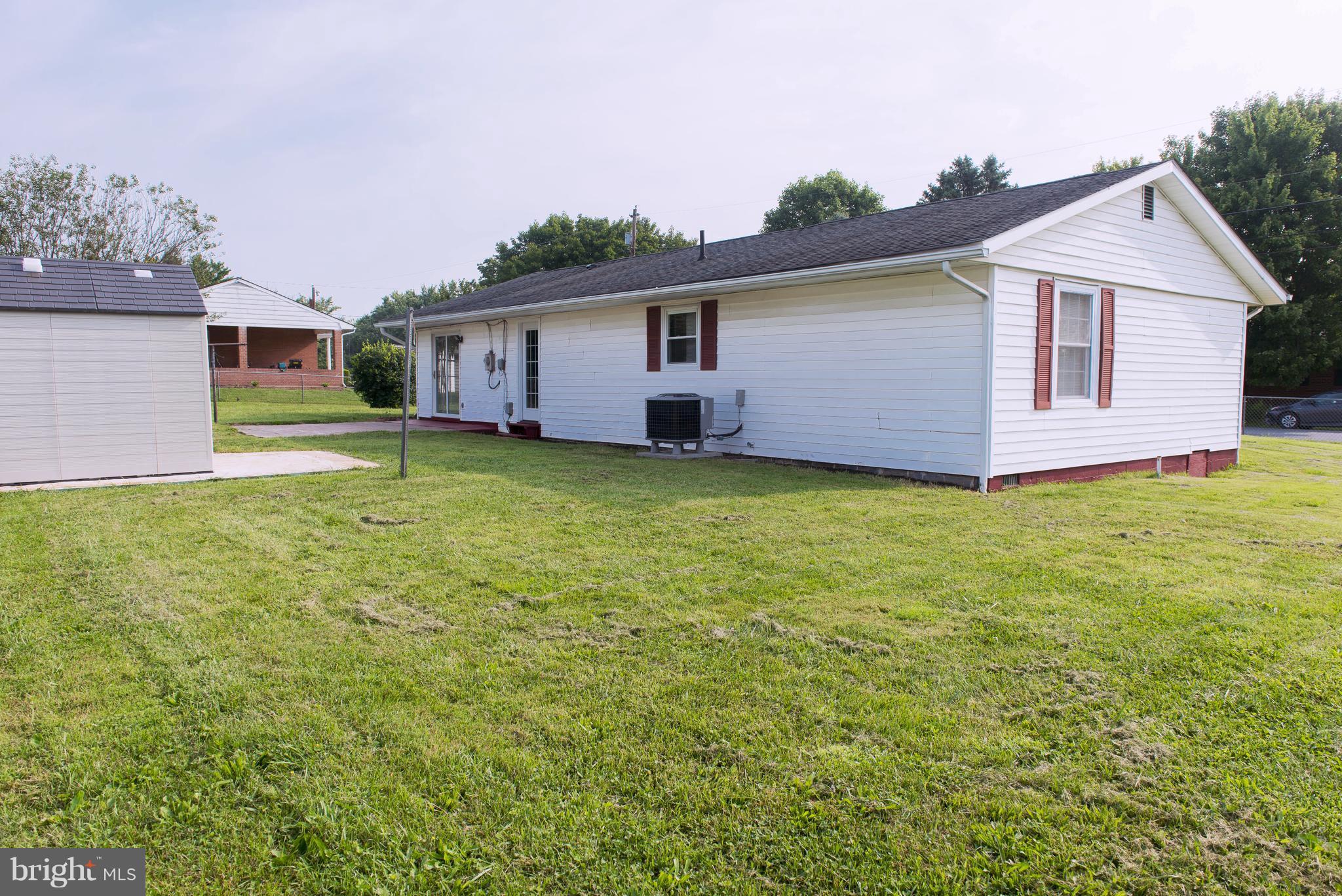 95 Orchard Drive Ranson, WV 25438 - Photo 20 of 22 a front view of house with yard and trees