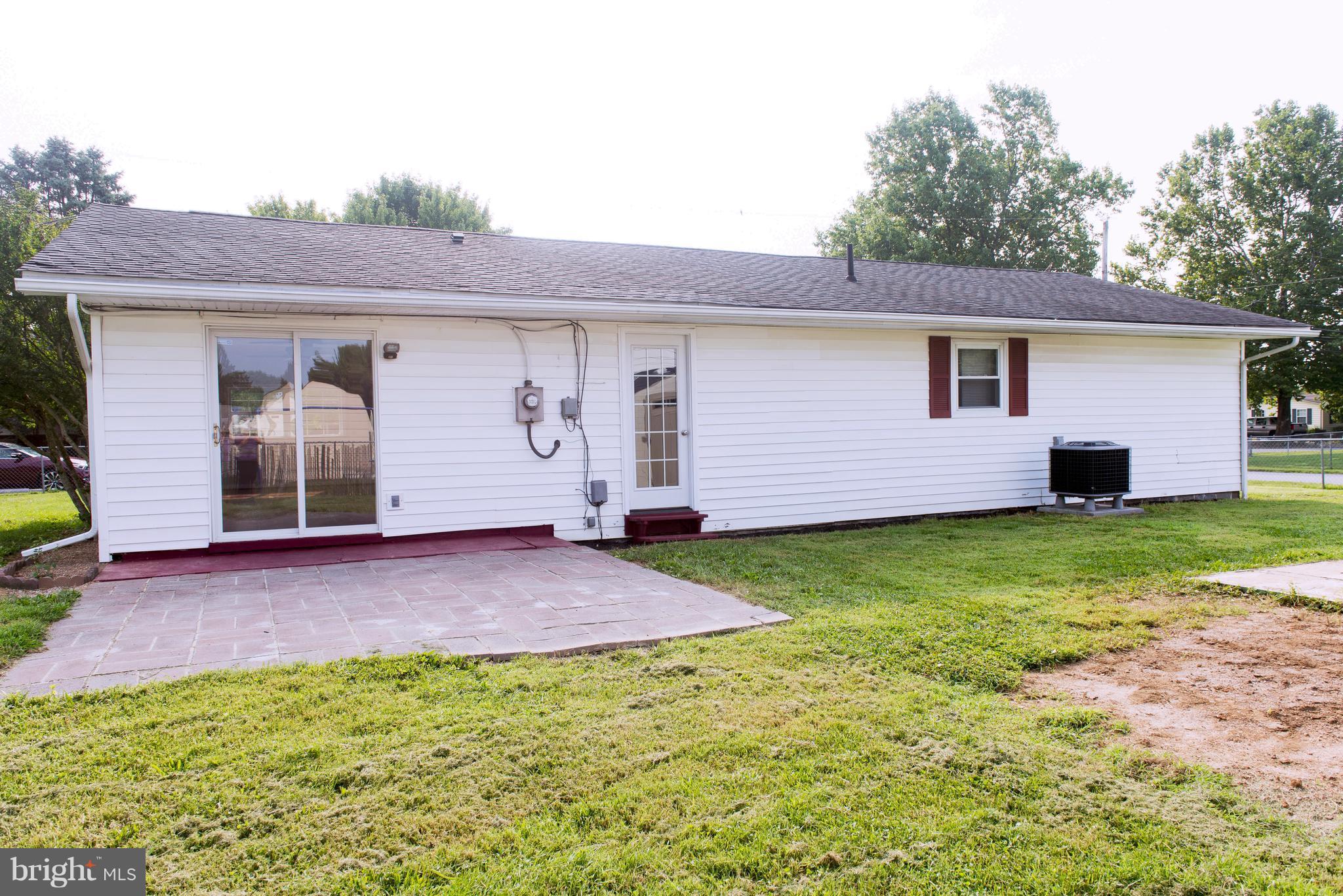 95 Orchard Drive Ranson, WV 25438 - Photo 21 of 22 a backyard of a house with yard and barbeque oven