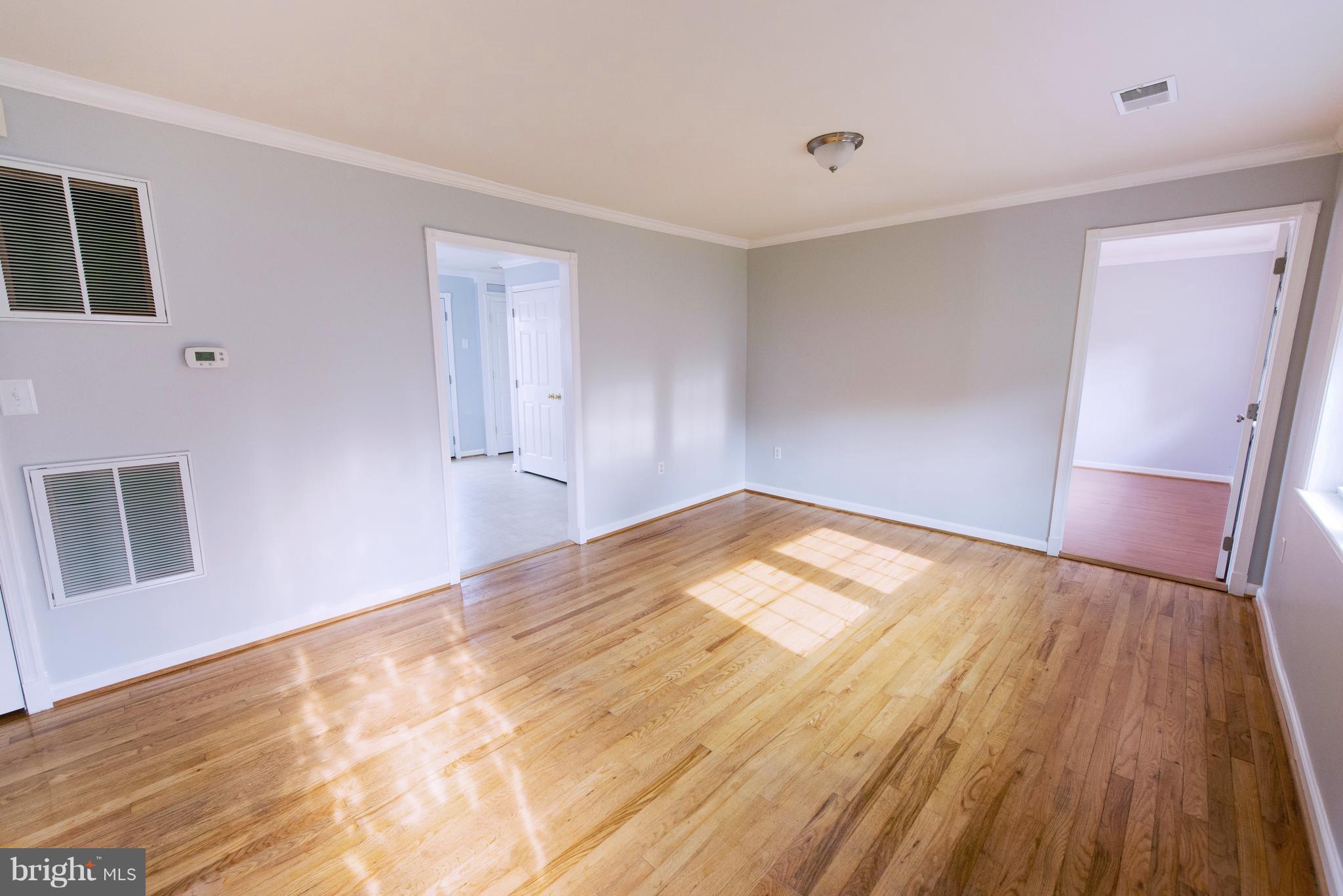 95 Orchard Drive Ranson, WV 25438 - Photo 5 of 22 a view of empty room with wooden floor and fan