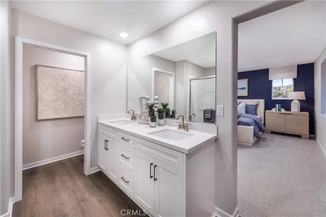 a spacious bedroom with a bed and a large window