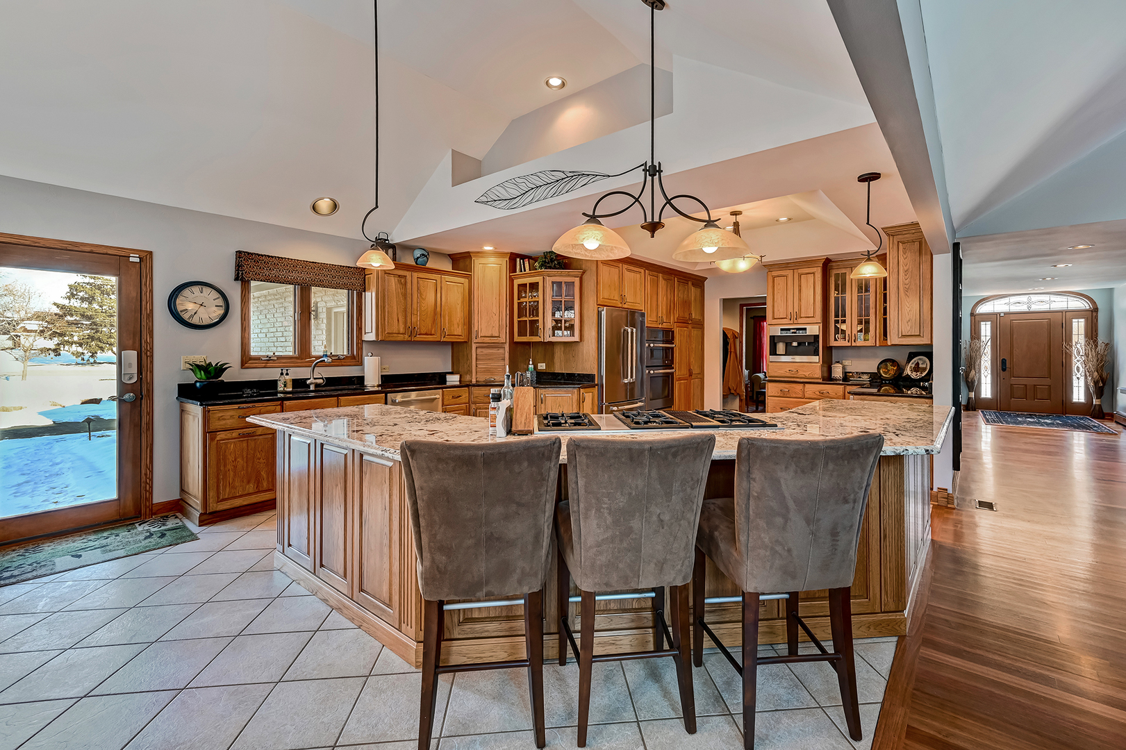 8300 South County Line Road Burr Ridge, IL 60527 - Photo 13 of 37 a large kitchen with a table and chairs