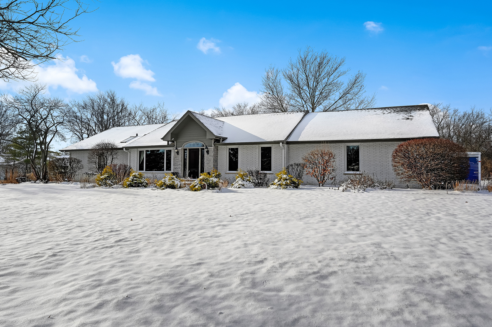 8300 South County Line Road Burr Ridge, IL 60527 - Photo 2 of 37 a front view of a house with a yard and garage