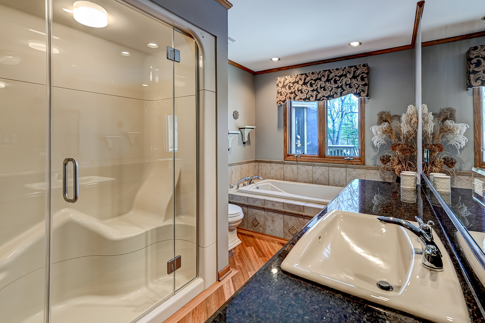 8300 South County Line Road Burr Ridge, IL 60527 - Photo 23 of 37 a bathroom with a sink a toilet and shower