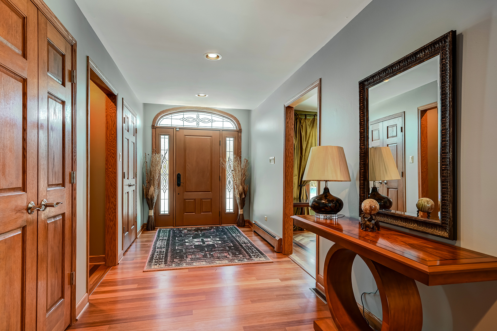 8300 South County Line Road Burr Ridge, IL 60527 - Photo 3 of 37 a view of a hallway with mirror and furniture