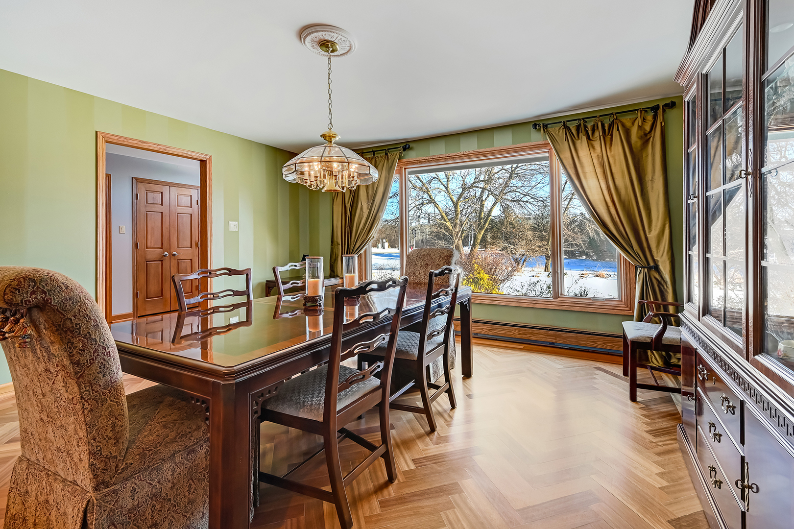 8300 South County Line Road Burr Ridge, IL 60527 - Photo 5 of 37 a dining room with furniture a chandelier and window