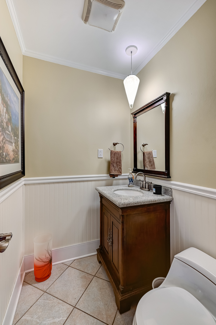 8300 South County Line Road Burr Ridge, IL 60527 - Photo 8 of 37 a bathroom with a granite countertop sink a toilet and a mirror
