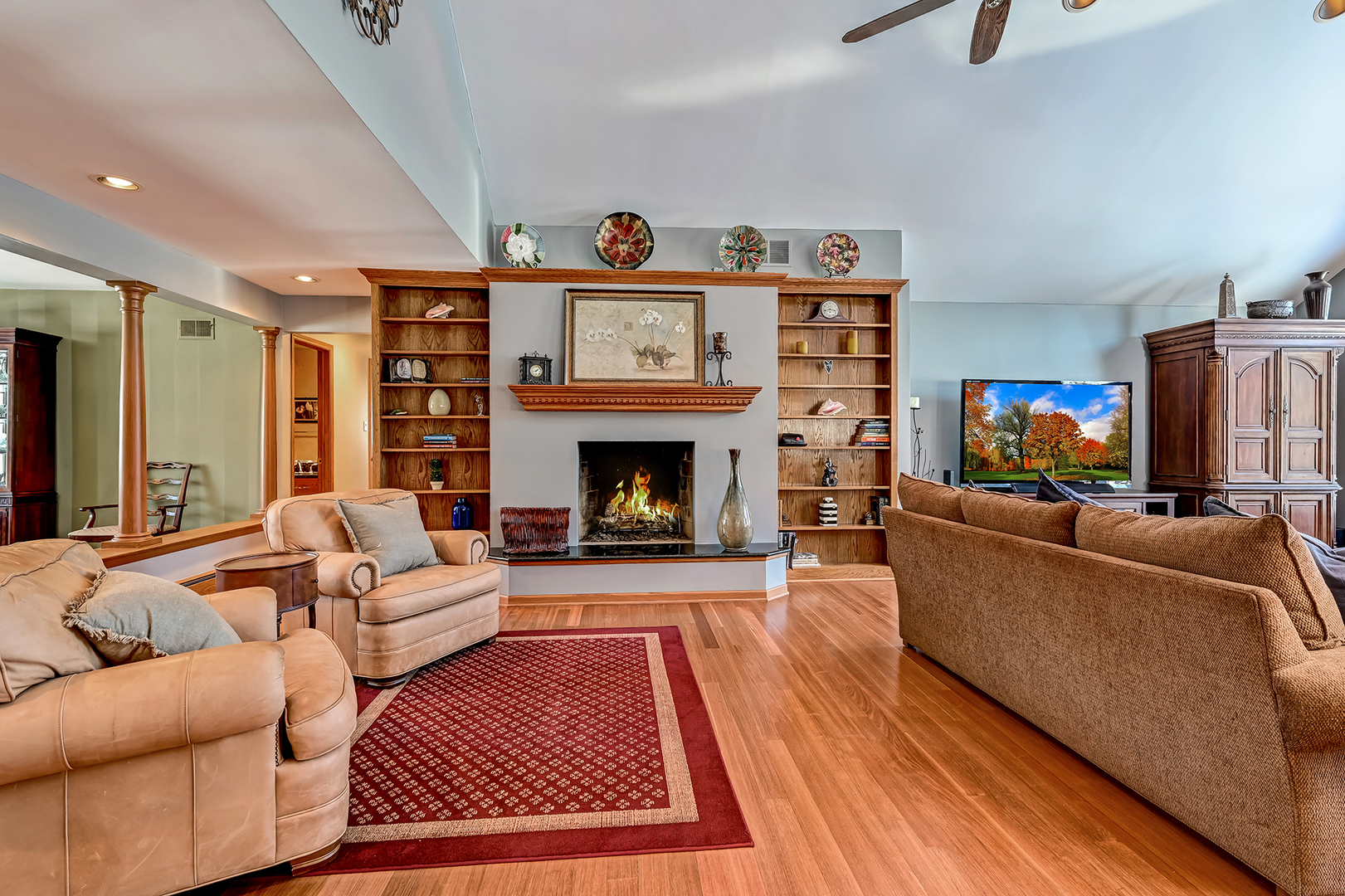 8300 South County Line Road Burr Ridge, IL 60527 - Photo 10 of 37 a living room with furniture and a fireplace