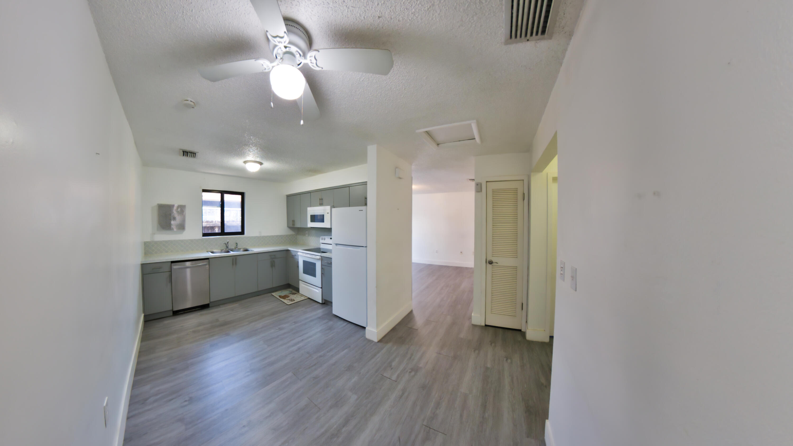 2620 Southwest 32nd Avenue Miami, FL 33133 - Photo 18 of 19 a kitchen with a refrigerator and a sink