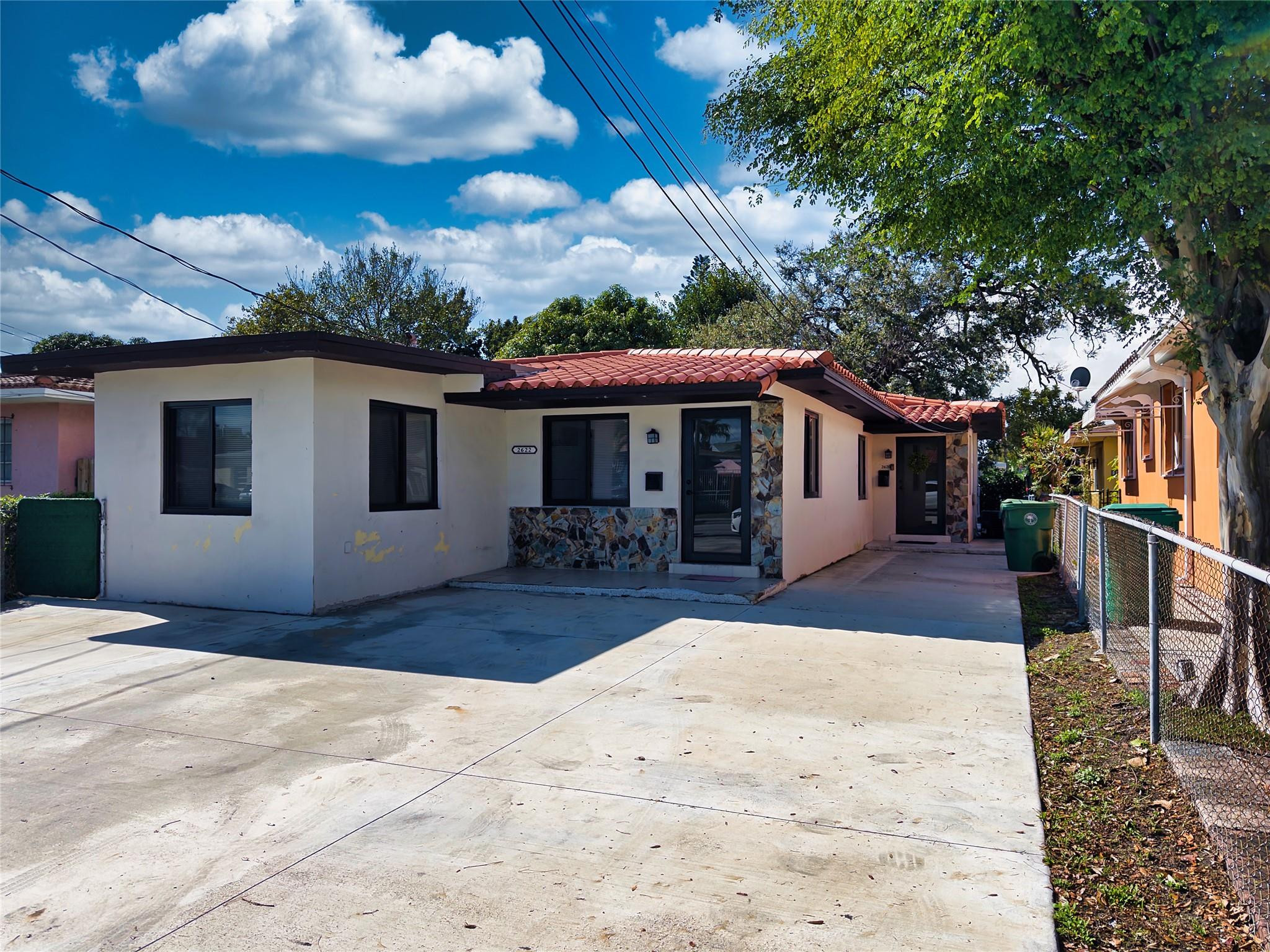2620 Southwest 32nd Avenue Miami, FL 33133 - Photo 7 of 19 a front view of a house with a patio