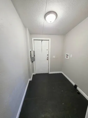 an empty room with a empty space and a window