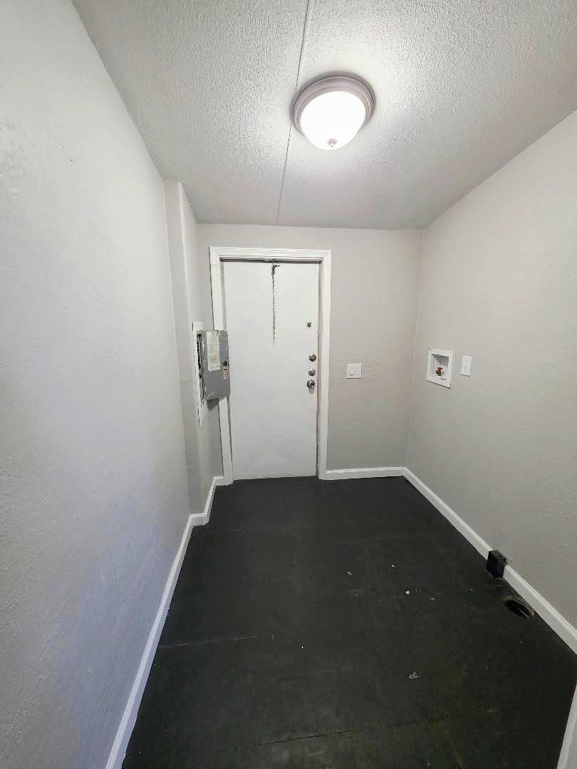 310 Paddock Street, Unit 5 Willis, TX 77378 - Photo 12 of 12 an empty room with a empty space and a window