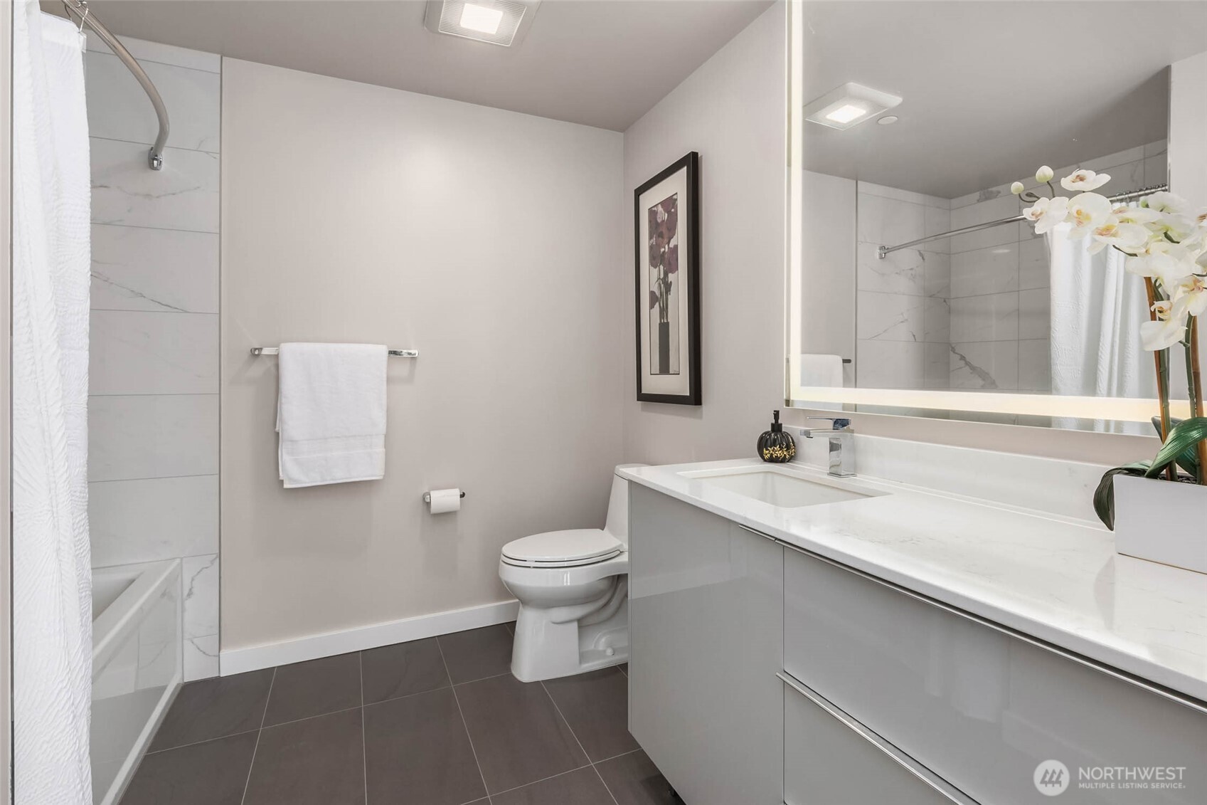 450 South Main Street, Unit 806 Seattle, WA 98104 - Photo 14 of 25 a bathroom with a sink toilet and shower