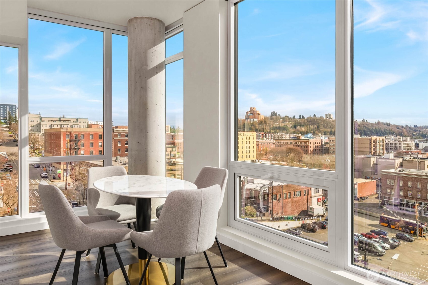 450 South Main Street, Unit 806 Seattle, WA 98104 - Photo 6 of 25 a dining room with furniture water view and a floor to ceiling window