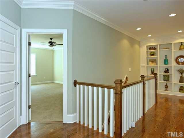 2304 Finley Ridge Lane Raleigh, NC 27615 - Photo 17 of 24 Upstairs Landing Shown With Wood Railings. Beautiful Hardwood Floors On The Second Floor Landing. Loft