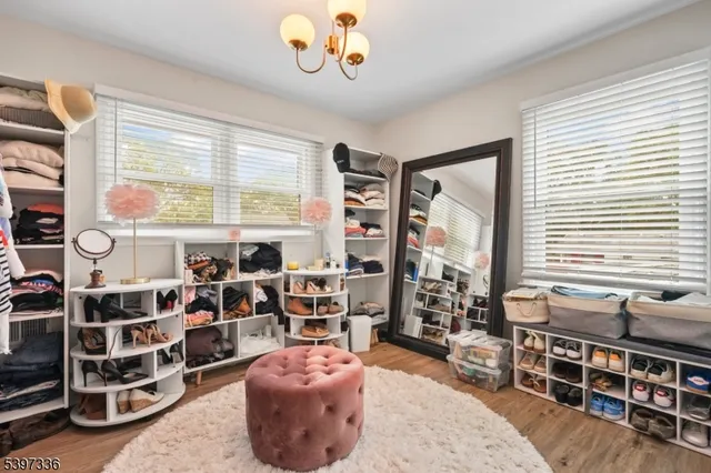 a view of a livingroom with furniture and windows