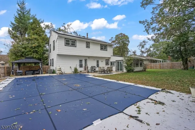 a view of house with yard and entertaining space