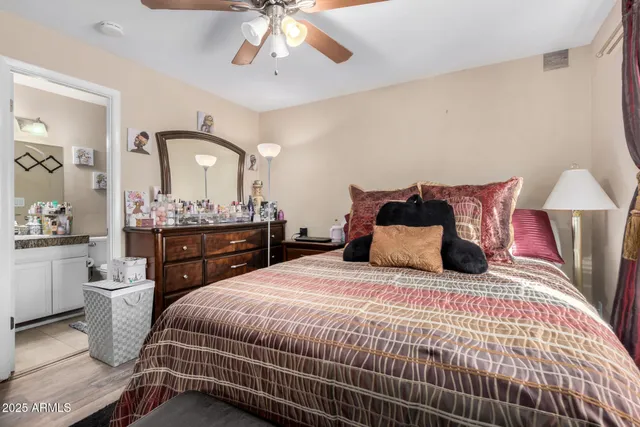 a bedroom with a bed and a mirror