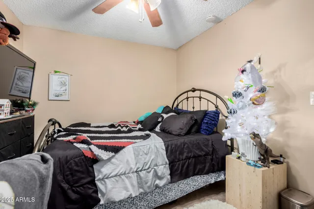 a bathroom with a granite countertop sink mirror toilet and shower
