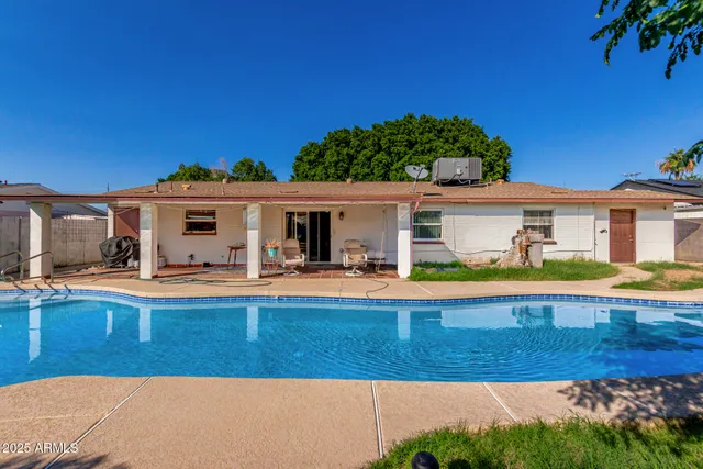 a view of swimming pool with lounge chair