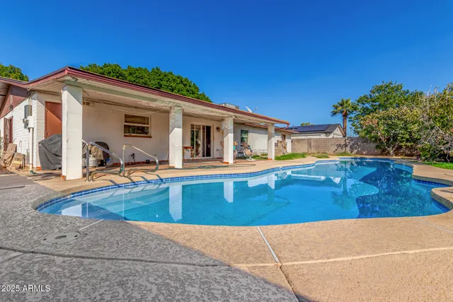 a view of a house with swimming pool