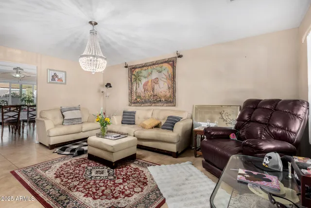 a living room with furniture or couch and a table