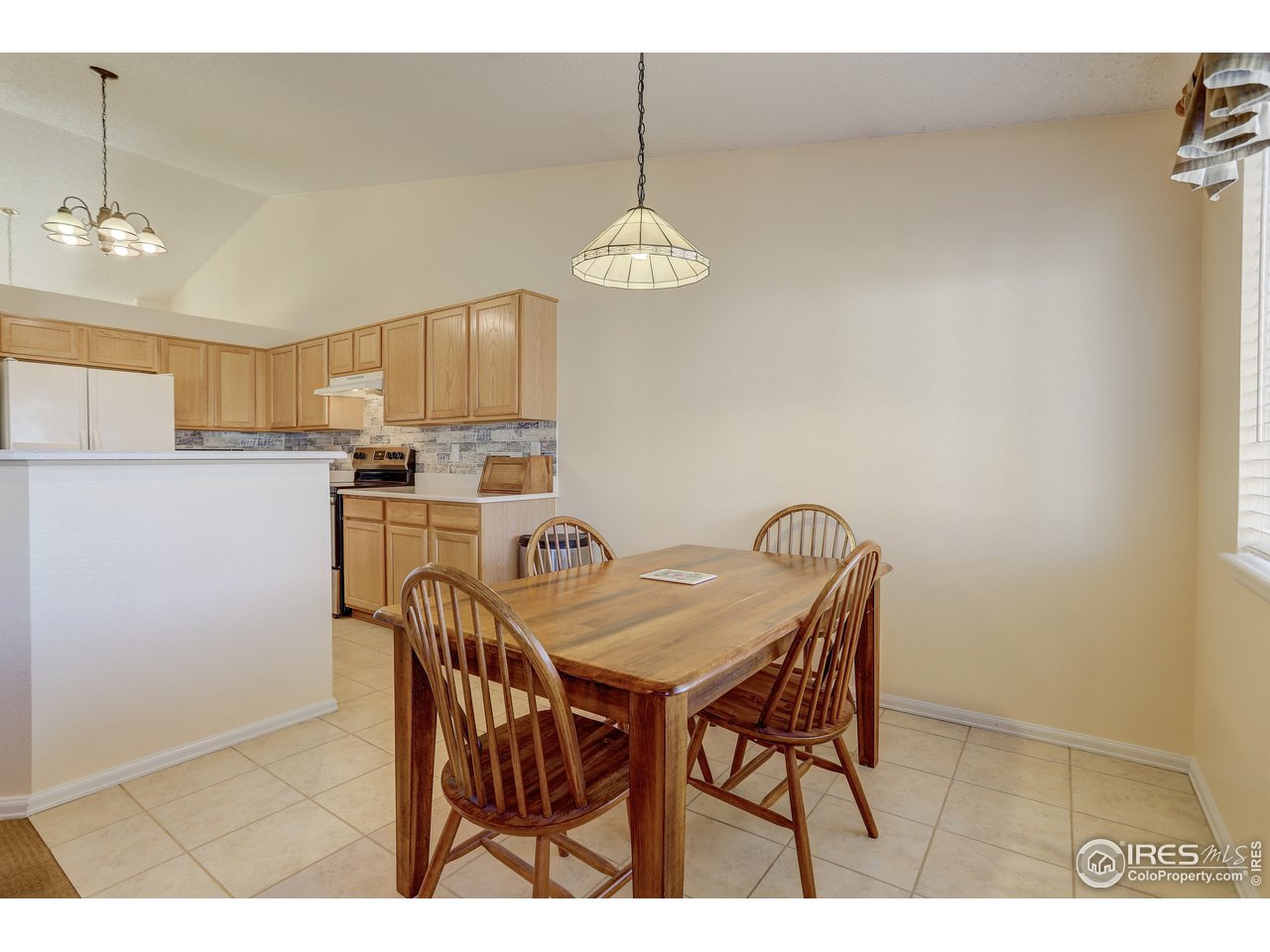 5403 Bobcat Street Frederick, CO 80504 - Photo 13 of 40 a view of a dining room with furniture