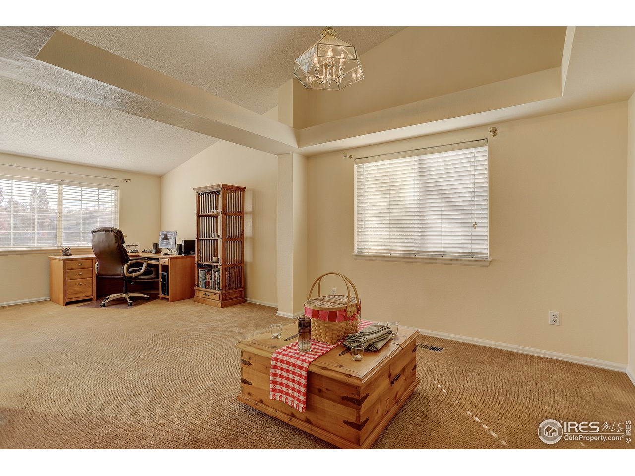 5403 Bobcat Street Frederick, CO 80504 - Photo 7 of 40 a living room with furniture a flat screen tv and a window
