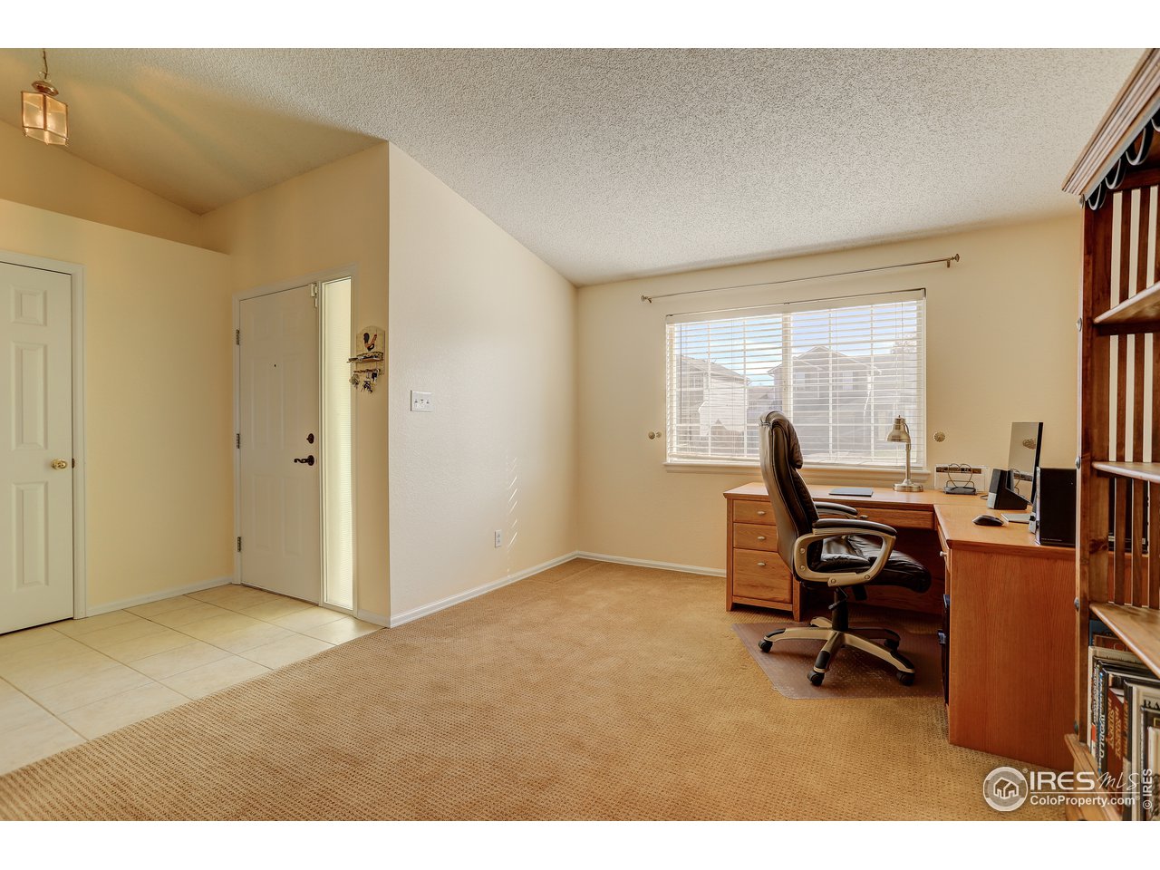 5403 Bobcat Street Frederick, CO 80504 - Photo 8 of 40 a view of a workspace with furniture and a window