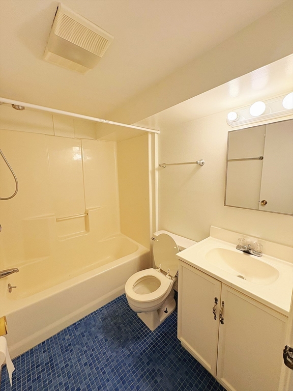 55 Sutherland Road, Unit 55 Arlington, MA 02476 - Photo 12 of 23 a bathroom with a sink a toilet and a bathtub