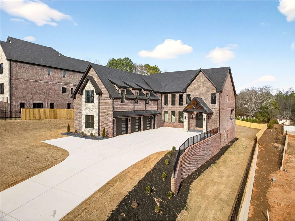 403 Thunder Road Buford, GA 30518 - Photo 4 of 88 a view of a house with a big yard