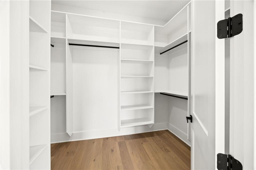 403 Thunder Road Buford, GA 30518 - Photo 69 of 88 a view of walk in closet with empty racks
