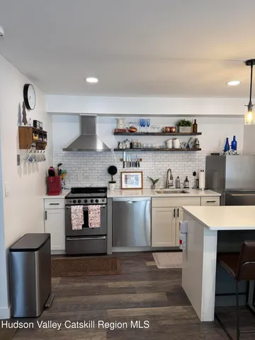 a kitchen with a stove and cabinets
