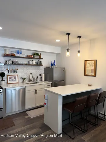 a kitchen that has a cabinets and a stove