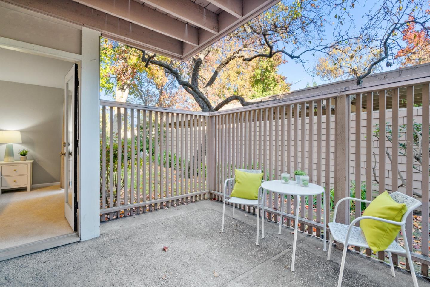 a view of a chairs and table in the balcony