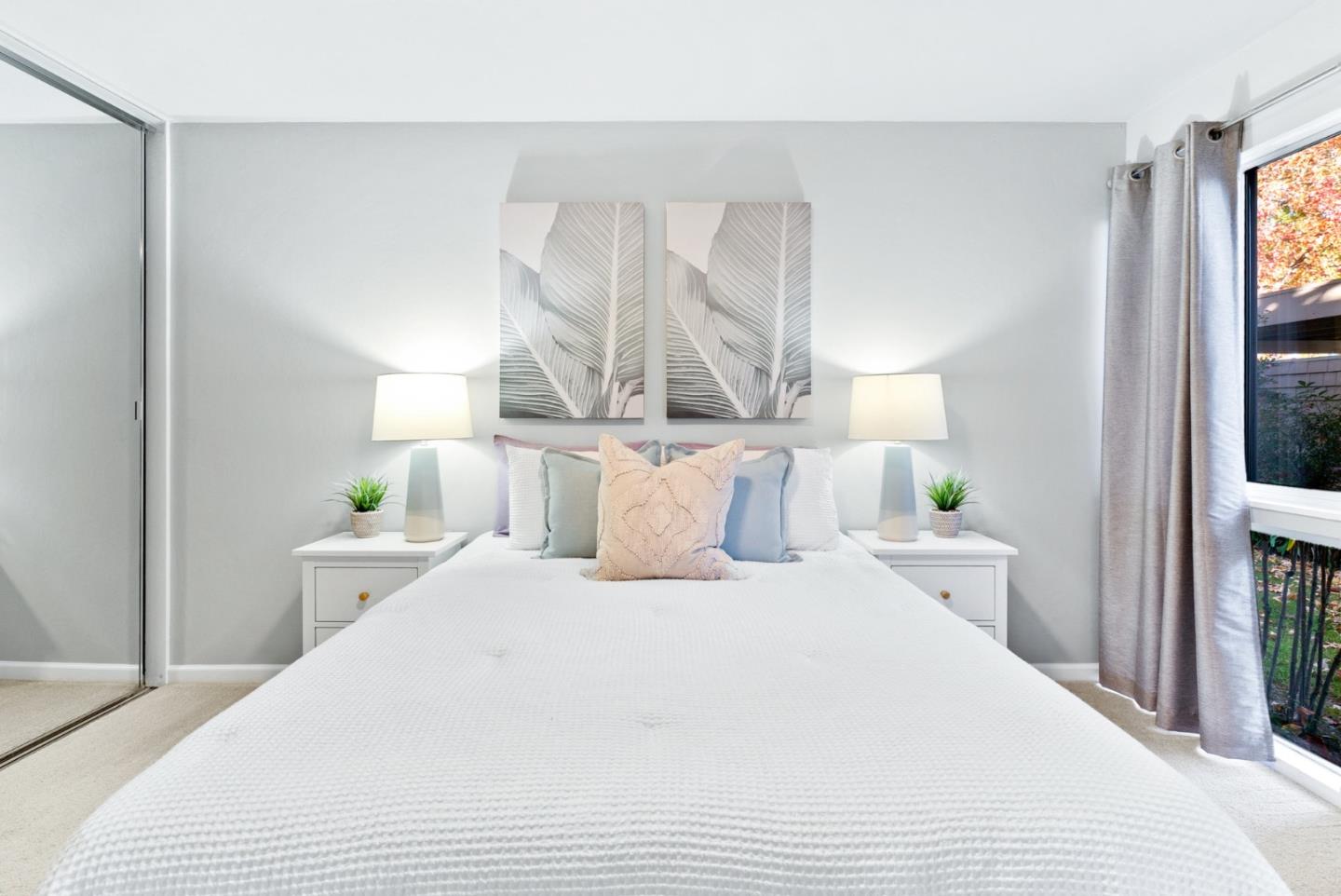280 Easy Street, Unit 403 Mountain View, CA 94043 - Photo 15 of 21 a bed room with a bed and a night stand