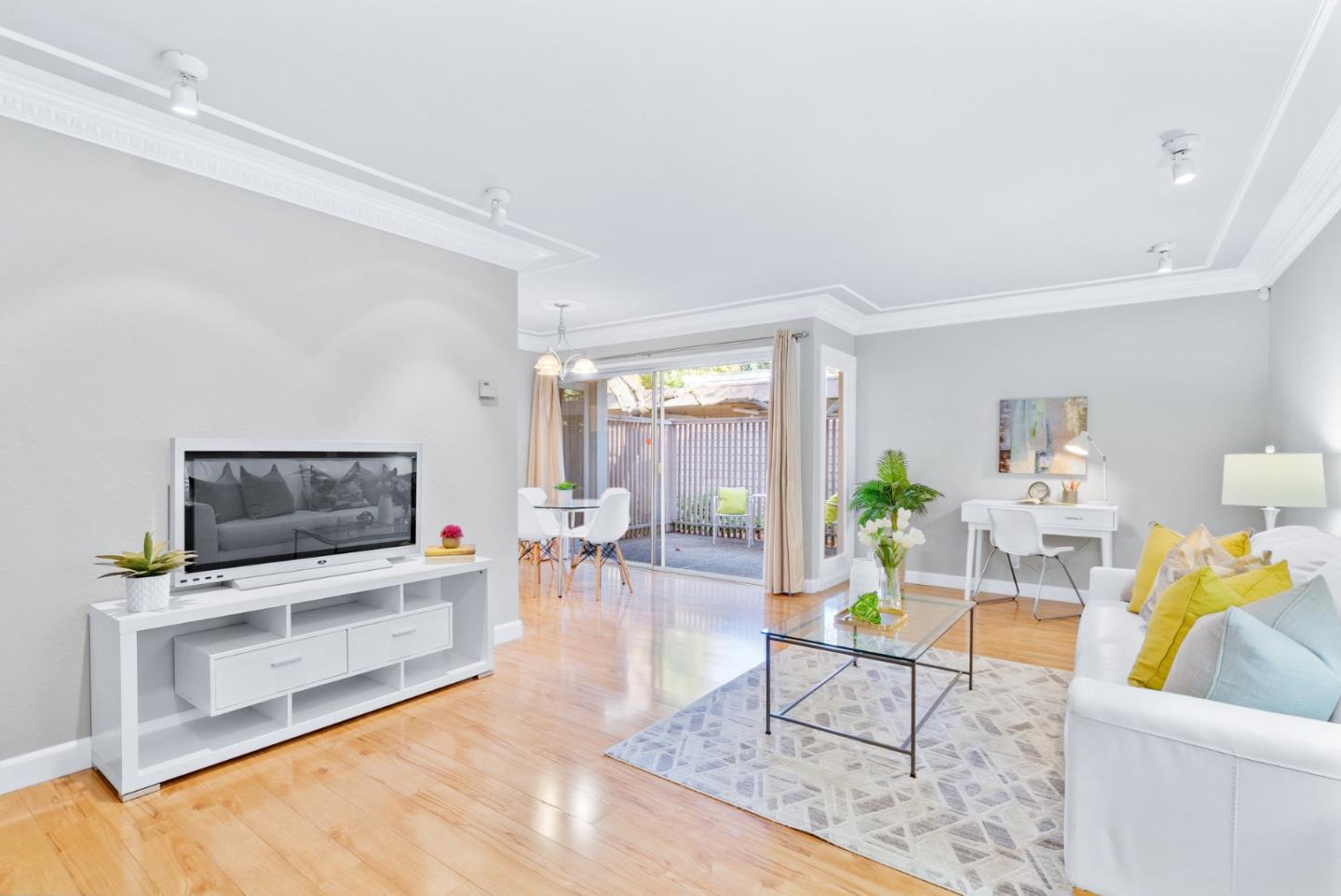 280 Easy Street, Unit 403 Mountain View, CA 94043 - Photo 5 of 21 a living room with furniture and a flat screen tv