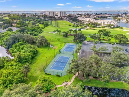 an aerial view of a houses with a yard