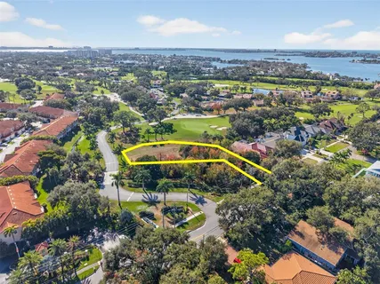an aerial view of residential houses with outdoor space and swimming pool