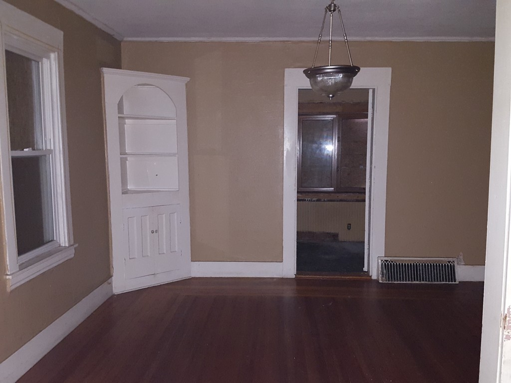 82 Miller Street Springfield, MA 01104 - Photo 4 of 8 an empty room with closet and windows