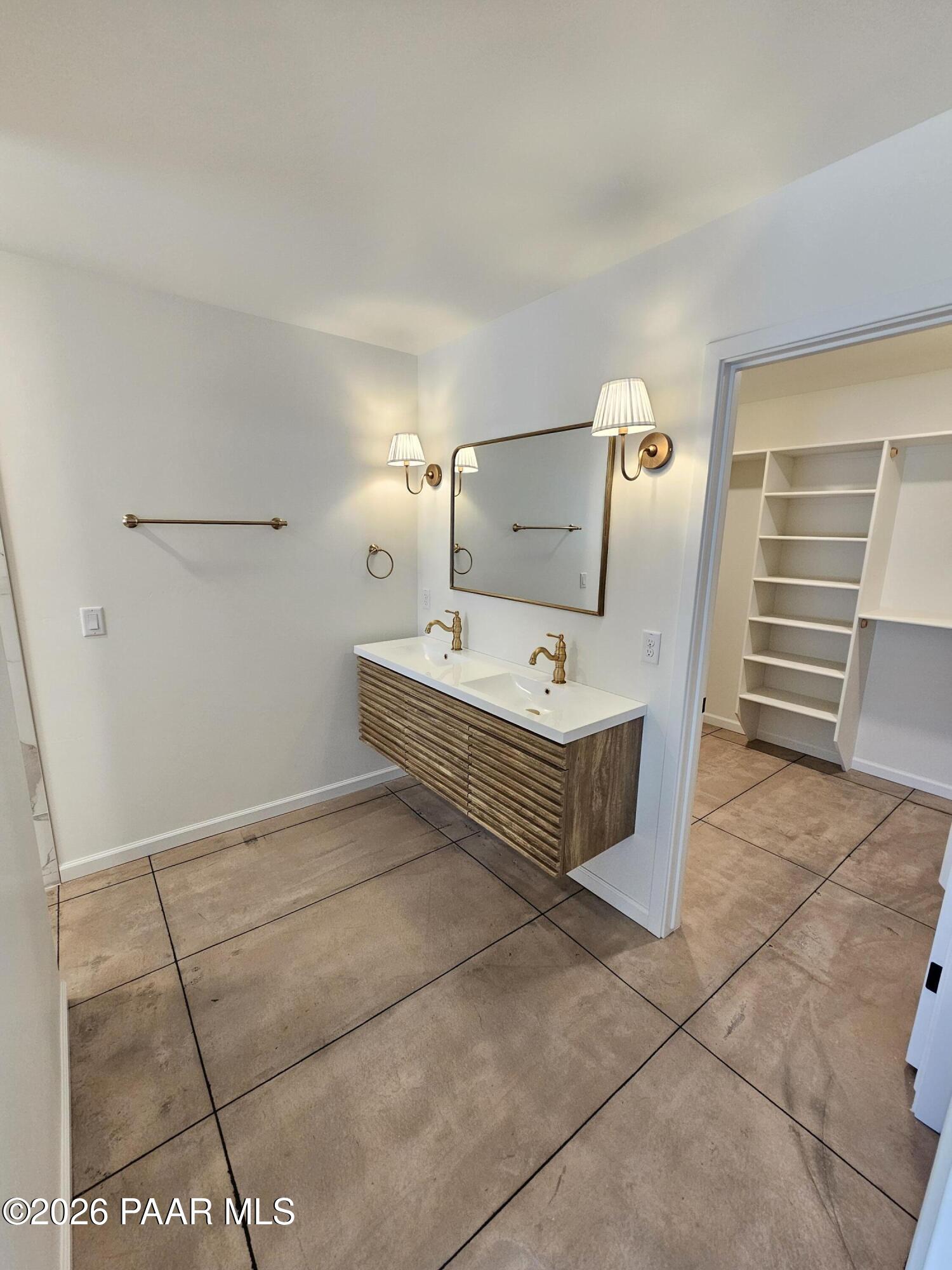 4920 East Amber Road Prescott, AZ 86301 - Photo 23 of 38 a bathroom with a sink and a mirror