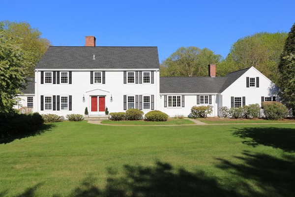 17 Aspen Road Weston, MA 02493 - Photo 1 of 27 a view of a white house with a yard and plants