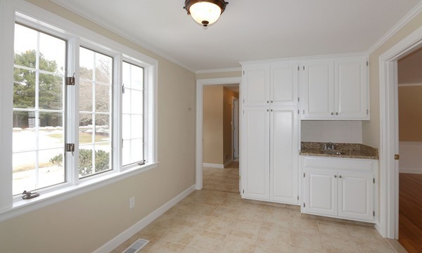17 Aspen Road Weston, MA 02493 - Photo 11 of 27 a view of an empty room with a window