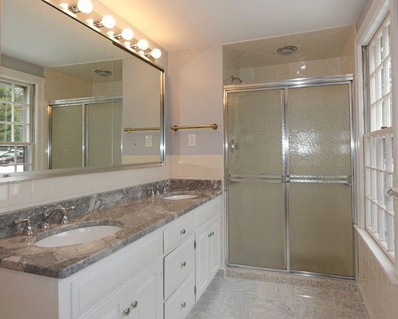 17 Aspen Road Weston, MA 02493 - Photo 14 of 27 a bathroom with a granite countertop sink and a mirror